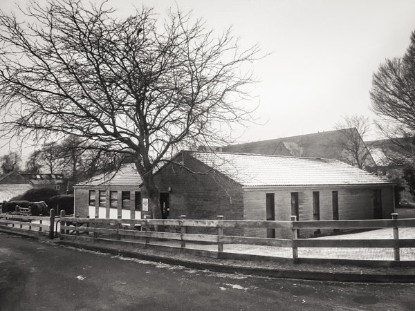 Current photograph of Minchinhampton Community Library with a sprinkling of snow